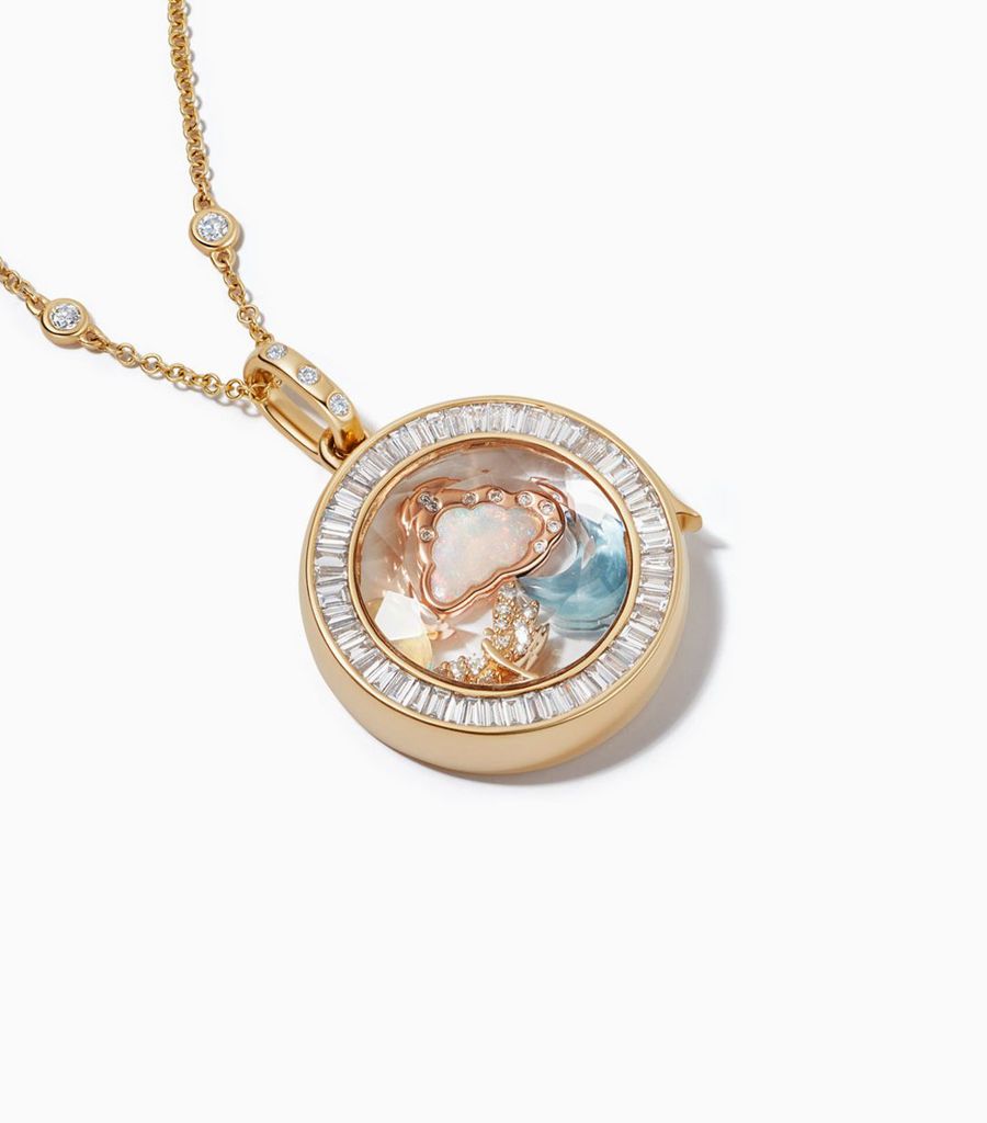 Baguette diamond locket necklace styled with 18k gold charms by Loquet London