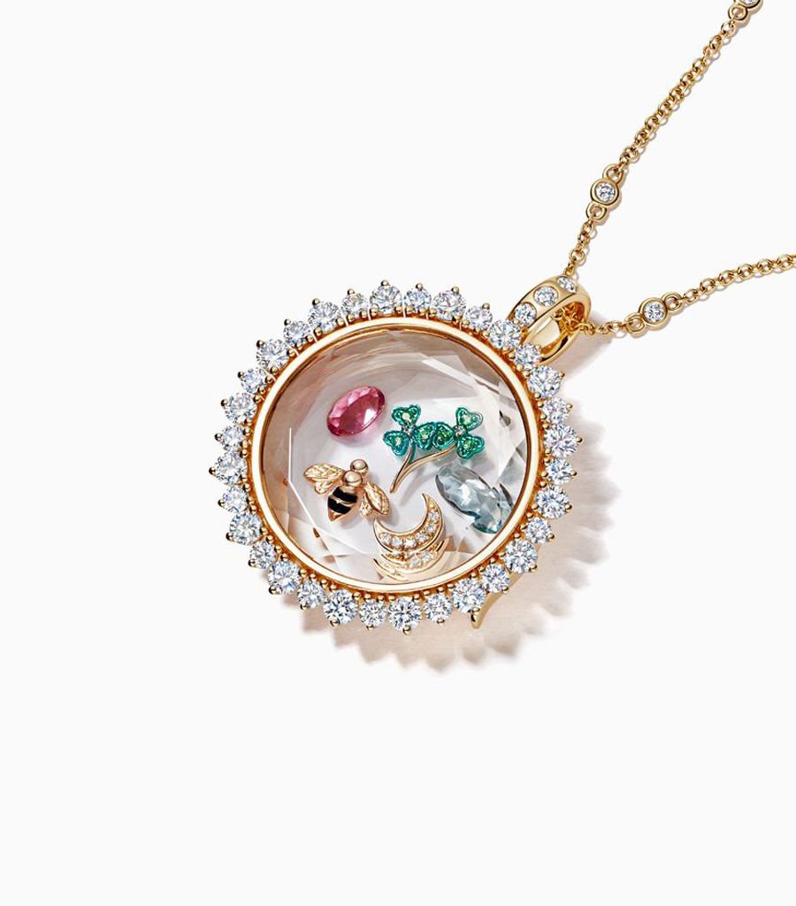 Diamond Miasol locket necklace styled with 18k gold charms by Loquet London
