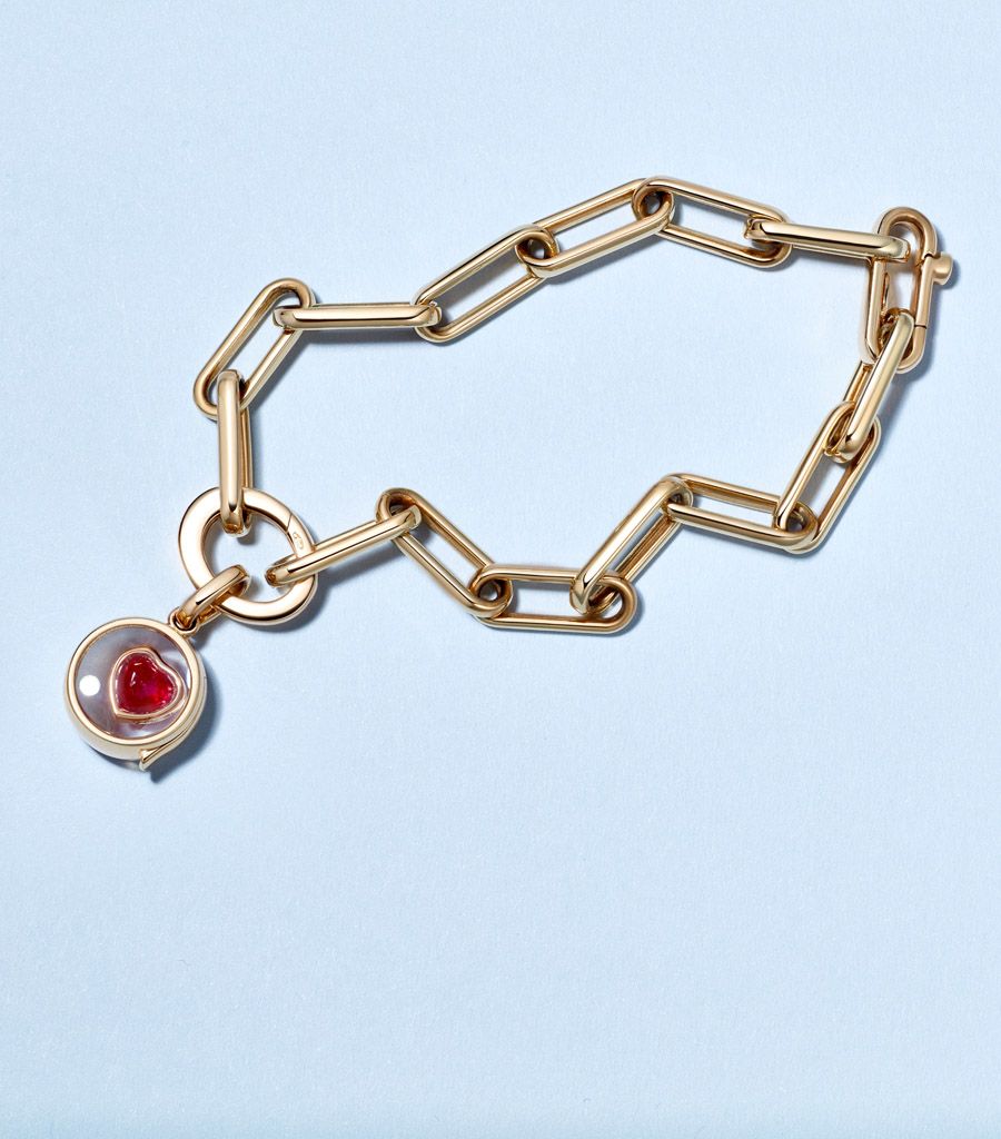 Charm link bracelet by Loquet London styled with a ruby heart charm