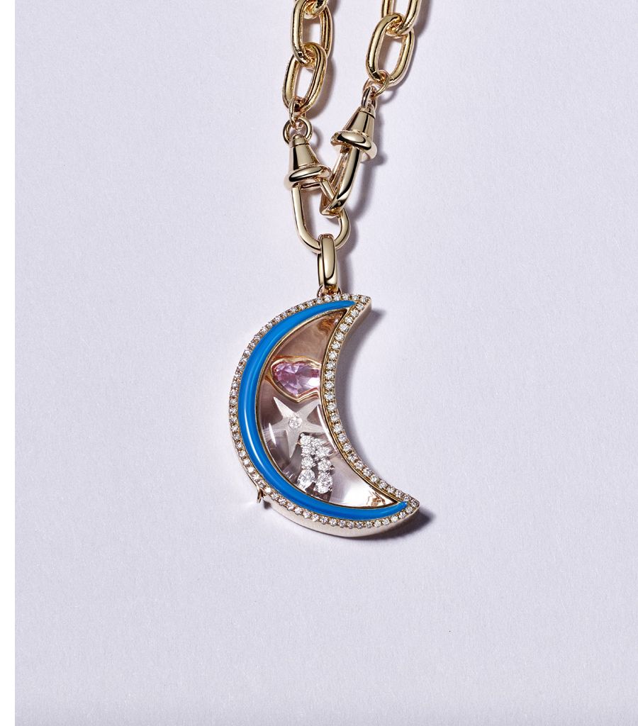 Moon locket gift set with charms and a chain on a purple background
