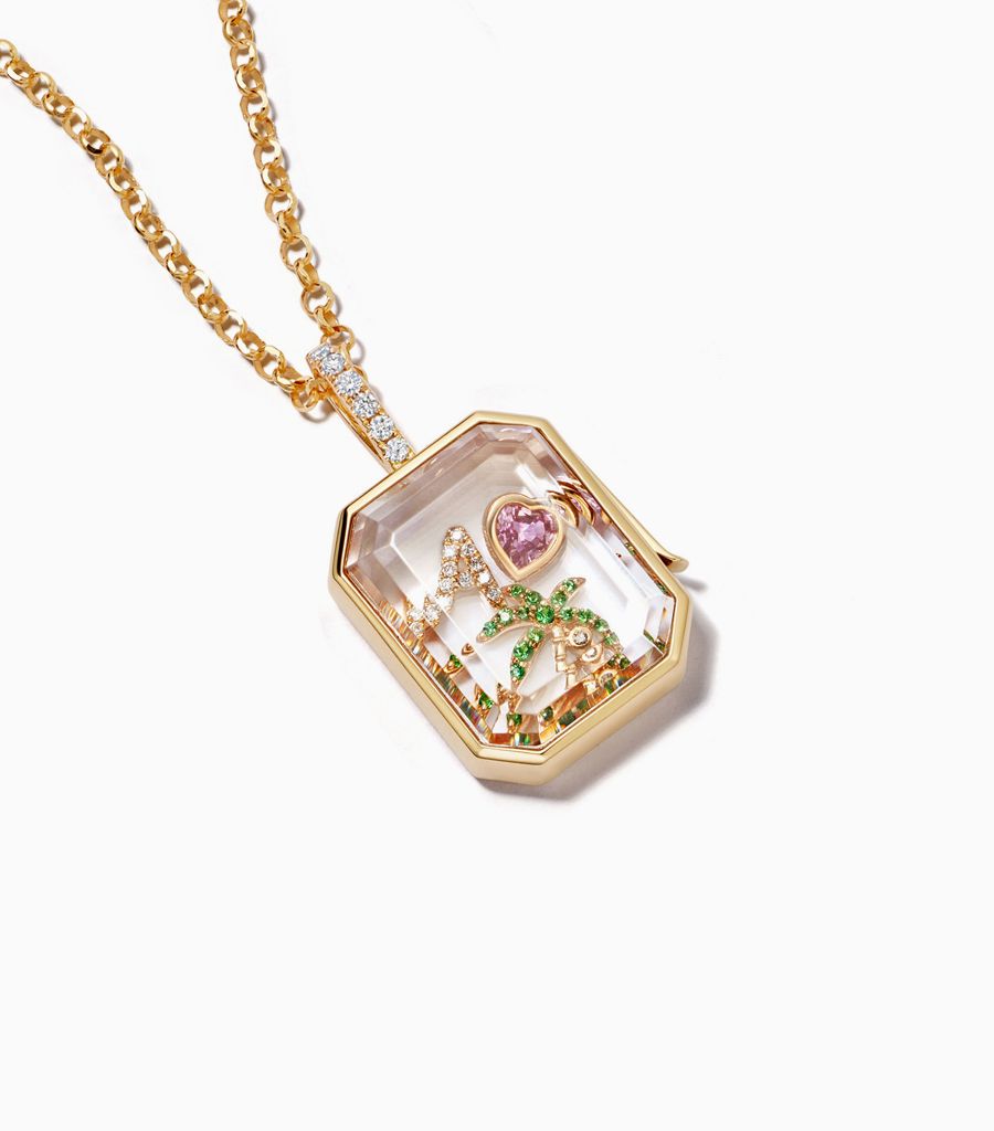 Diamond baguette locket necklace styled with 18k charms by Loquet London