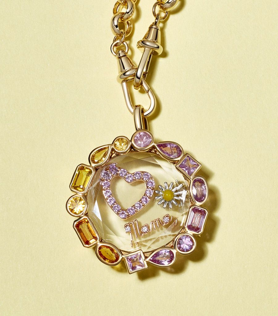 pre-made pink and yellow sapphire locket pendant styled with a daisy charm, a mama charm and a pink sapphire heart charm by Loquet London