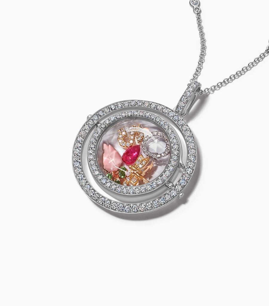 Diamond revolving locket necklace styled with 18k charms by Loquet London