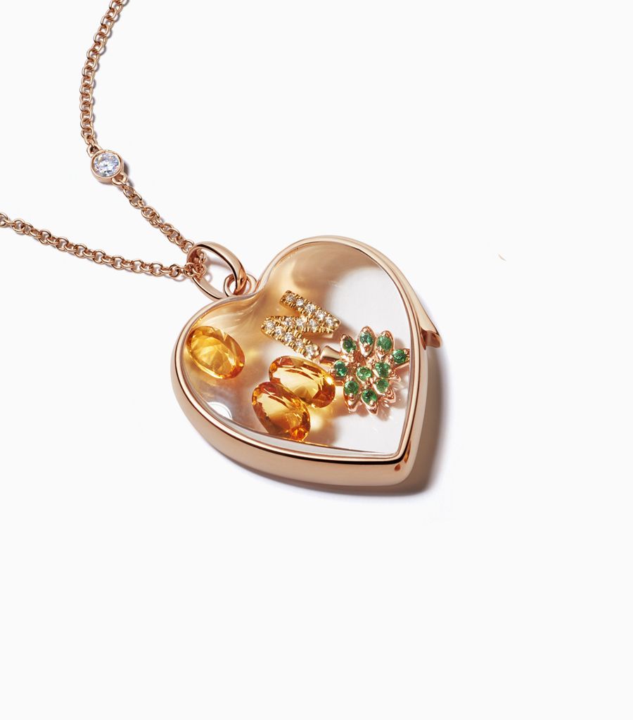 Large Rose gold heart locket necklace styled with 18k gold charms by Loquet London