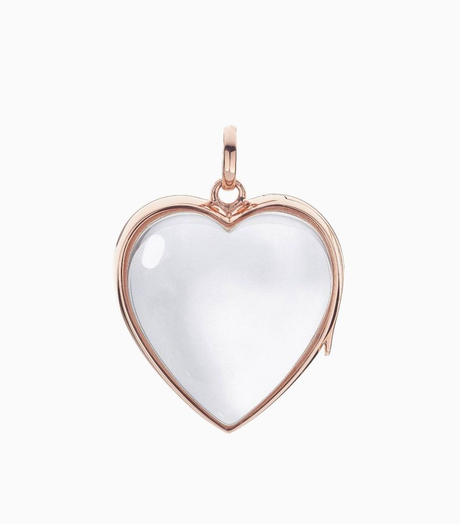 9carat rose gold, heart shaped locket, set with a bevel edged, crystal glass front and a flat crystal glass back. The locket is designed with a side hindge for secure fastening and has a 24mm drop and a 22.5mm width