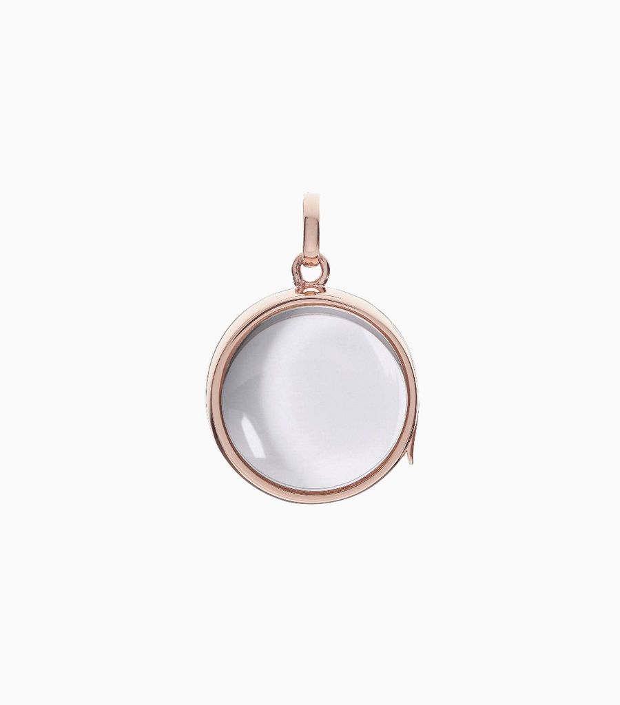 9carat rose gold, round shaped locket, set with a bevel edged, crystal glass front and a flat crystal glass back. The locket is designed with a side hindge for secure fastening and has a 18mm drop and a 17mm width
