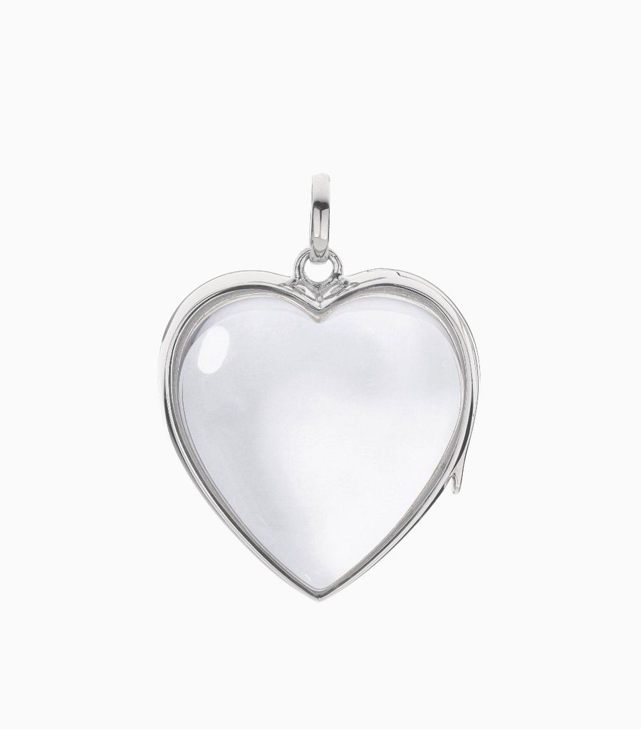 9carat white gold, heart shaped locket, set with a bevel edged, crystal glass front and a flat crystal glass back. The locket is designed with a side hindge for secure fastening and has a 24mm drop and a 22.5mm width
