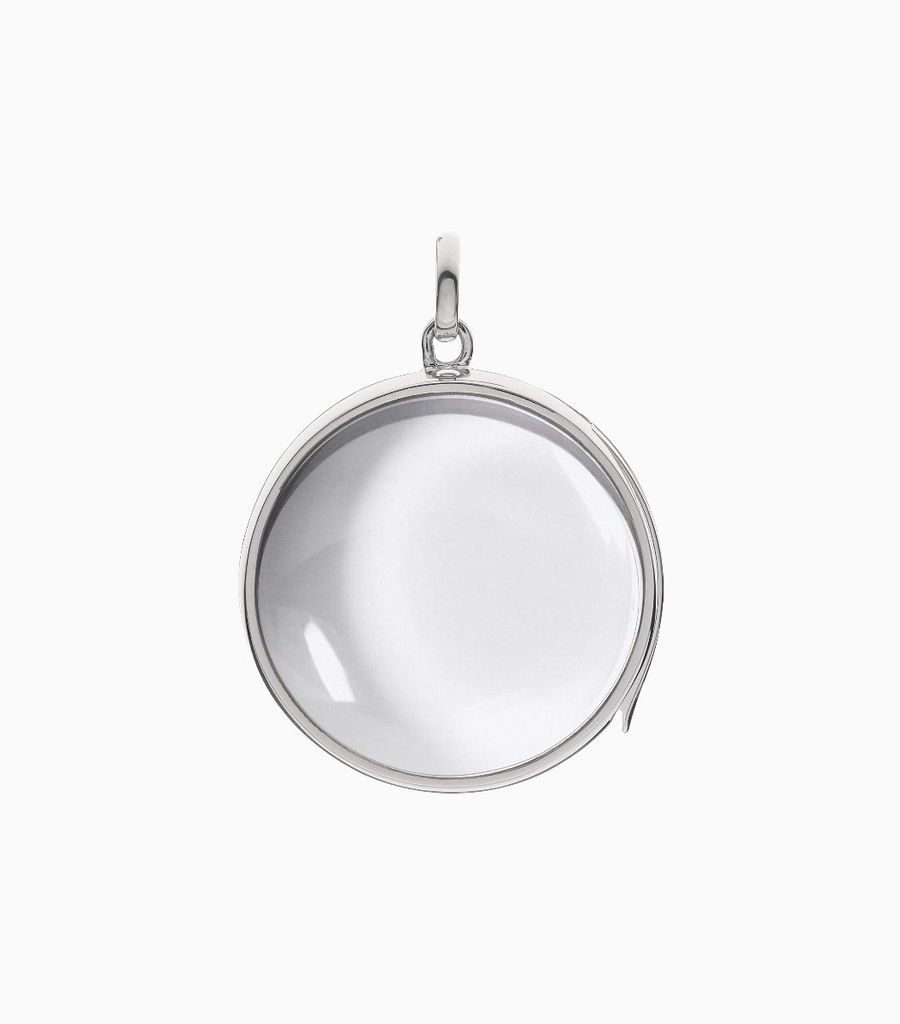 9carat white gold, round shaped locket, set with a bevel edged, crystal glass front and a flat crystal glass back. The locket is designed with a side hindge for secure fastening and has a 24mm drop and a 22.5mm width