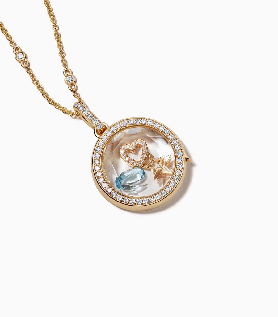 14k yellow gold locket pendant set with diamonds styled with 18k floating charms and a diamond chain