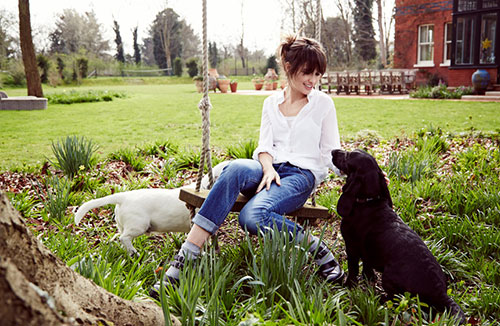 London’s Co-Founder and Creative Director Sheherazade Goldsmith with her rescue Dogs Lucky and Patch)